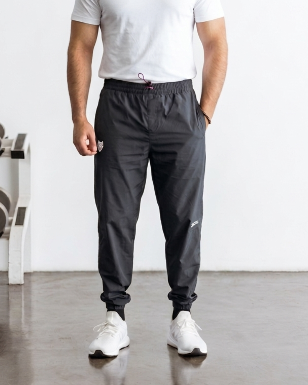 Men's black athletic joggers with elastic waistband and pockets.
