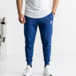 Men's blue joggers with elastic waistband and tapered fit.