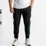 Men's casual black joggers with green side stripe detail for sporty style and comfort.