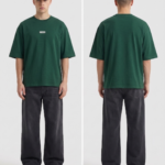 Men's green oversized t-shirt with small logo, paired with black jeans and cap.