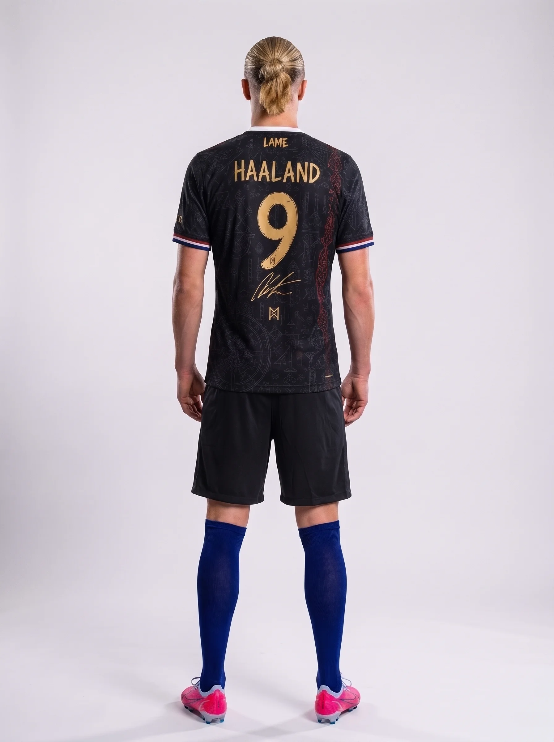 Back view of Norway Haaland football jersey with number 9 and signature.